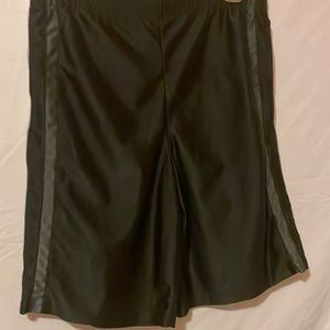 Black gym shorts with gray stripes down the sides.